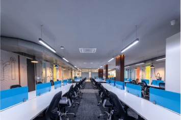 Collaborative workspace with colorful decor – Zluri office interior