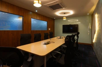 Sleek meeting room with glass partitions – Juego office design