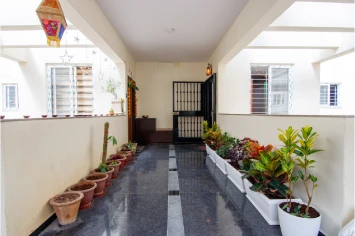 Balcony with elegant tiling and Plants – Prasad residence design
