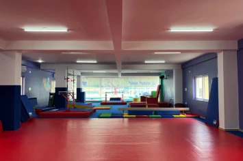 Spacious gym interior with strength training equipment – TLG fitness center